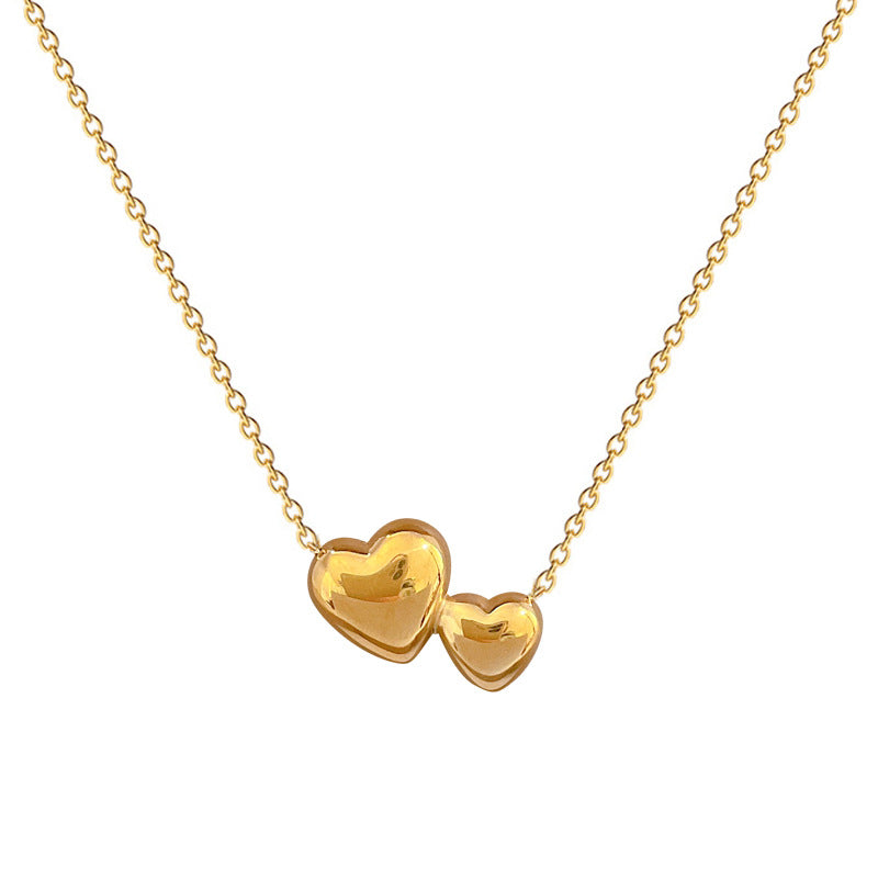 Collana Minimalista Unisex con Doppio Cuore Geometrico in Acciaio al Titanio