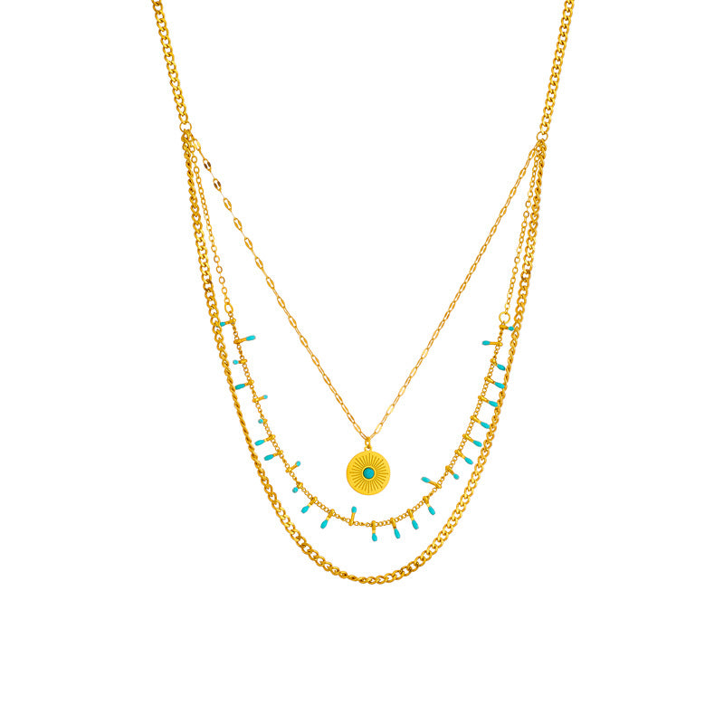 Collana da donna vintage in stile etnico con ciondolo rotondo turchese in acciaio al titanio con finitura placcata
