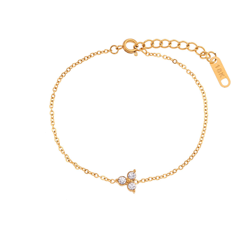 Elegante bracciale da donna placcato oro 18K in acciaio al titanio con strass a forma di fiore di loto