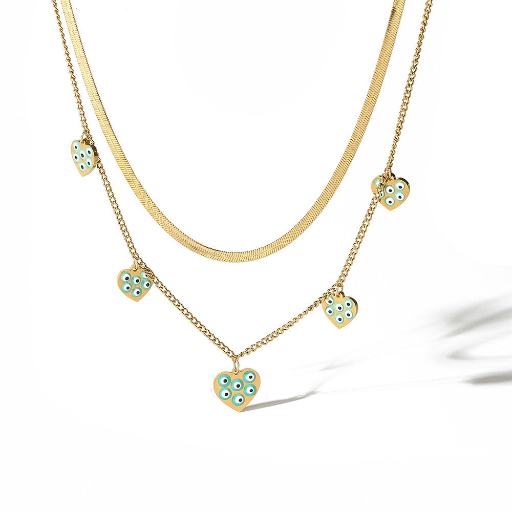 Collana da donna a doppio strato con catena alla clavicola in acciaio al titanio e ciondolo a forma di occhio geometrico smaltato minimalista