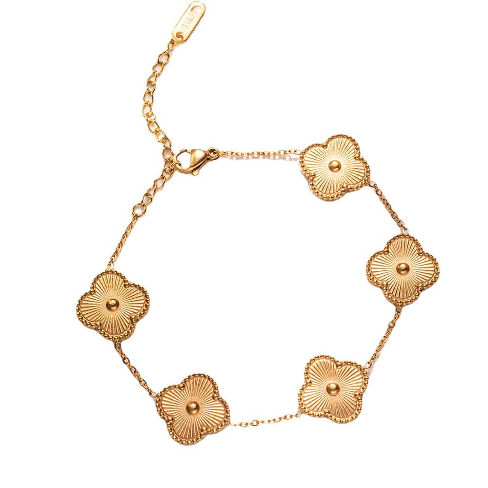 Pulsera minimalista de trébol floral en acero de titanio con chapado en oro de 18K para mujer