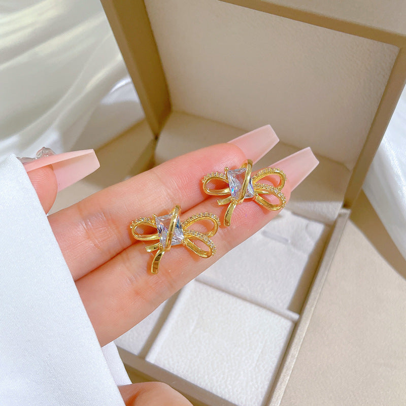 Set collana e orecchini minimalisti con fiocco in acciaio al titanio placcato per donna