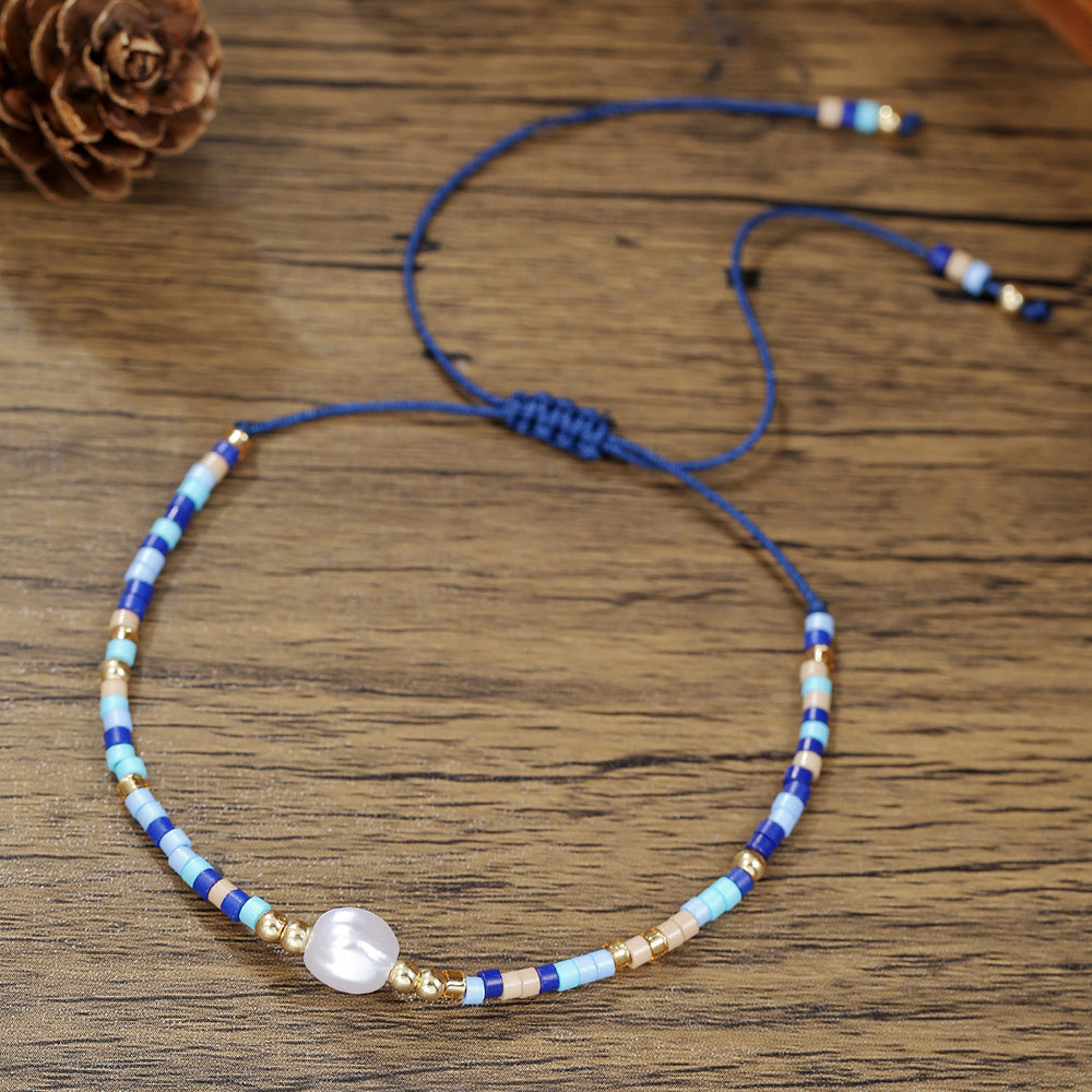 Bracciale bohémien regolabile da donna con perle, perline e perline di riso, dal design geometrico