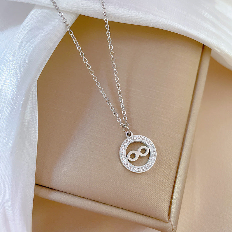 Collar para mujer de acero titanio y chapado en oro, diseño geométrico minimalista, con colgante circular y de figura de ocho