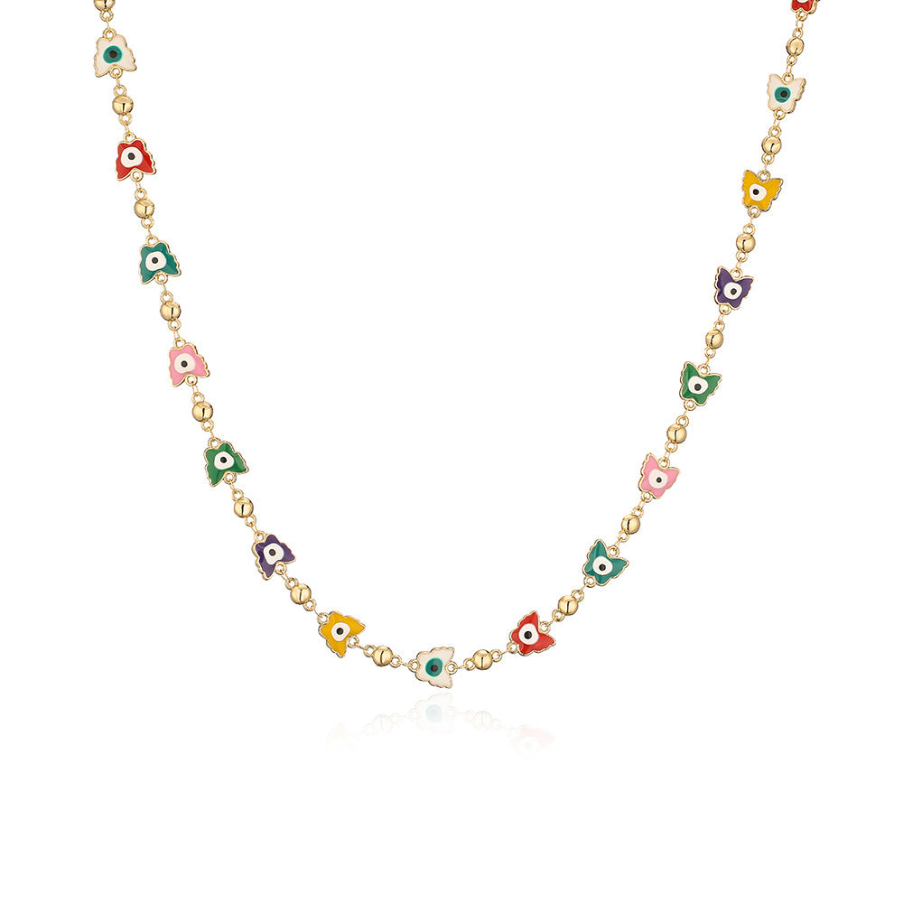 Collana minimalista da donna con ciondolo a Occhio di Allah geometrico in rame e finitura smaltata