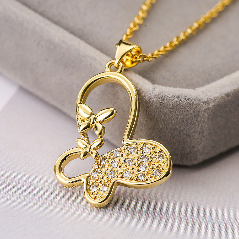 Collar con colgante de mariposa minimalista para mujer con cadena de cobre chapada en oro e incrustaciones de circonitas cúbicas