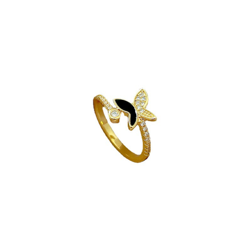 Anello a farfalla minimalista in ottone con finitura smaltata e intarsio di strass, regolabile da donna