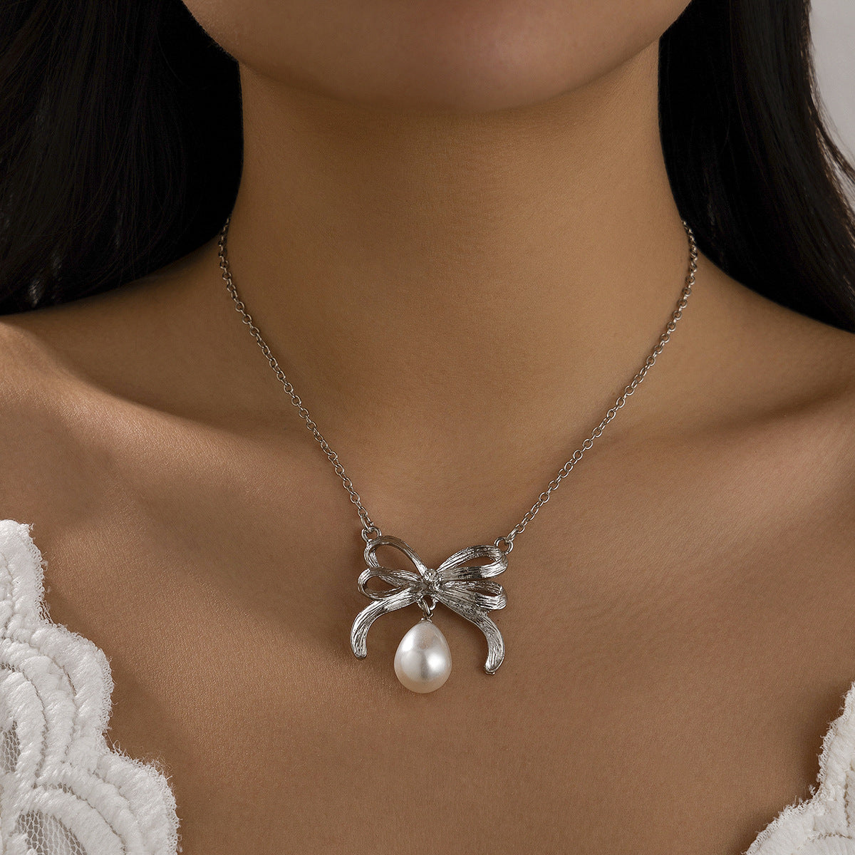 Minimalist Bow-Shaped Alloy Necklace with Simulated Pearl Pendant and Plated Finish for Women