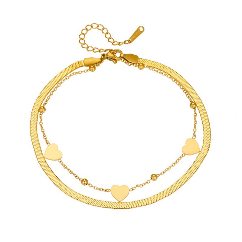 Cavigliera da donna alla moda placcata oro a forma di cuore in acciaio al titanio con design a doppio strato