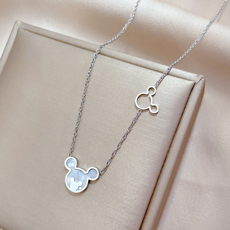 Collana girocollo minimalista in acciaio al titanio con motivo floreale, geometrico e cartone animato