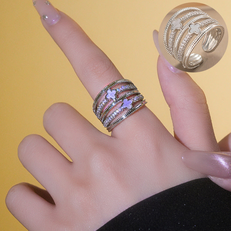 Anello da donna lussuoso e minimalista con fiore geometrico, intarsi in zircone e fascia regolabile in rame placcato oro