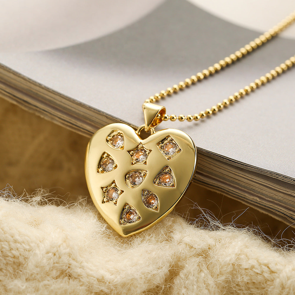 Collana con ciondolo a cuore e fiocco di neve minimalista da donna in rame con placcatura in oro vero e intarsio in zirconi