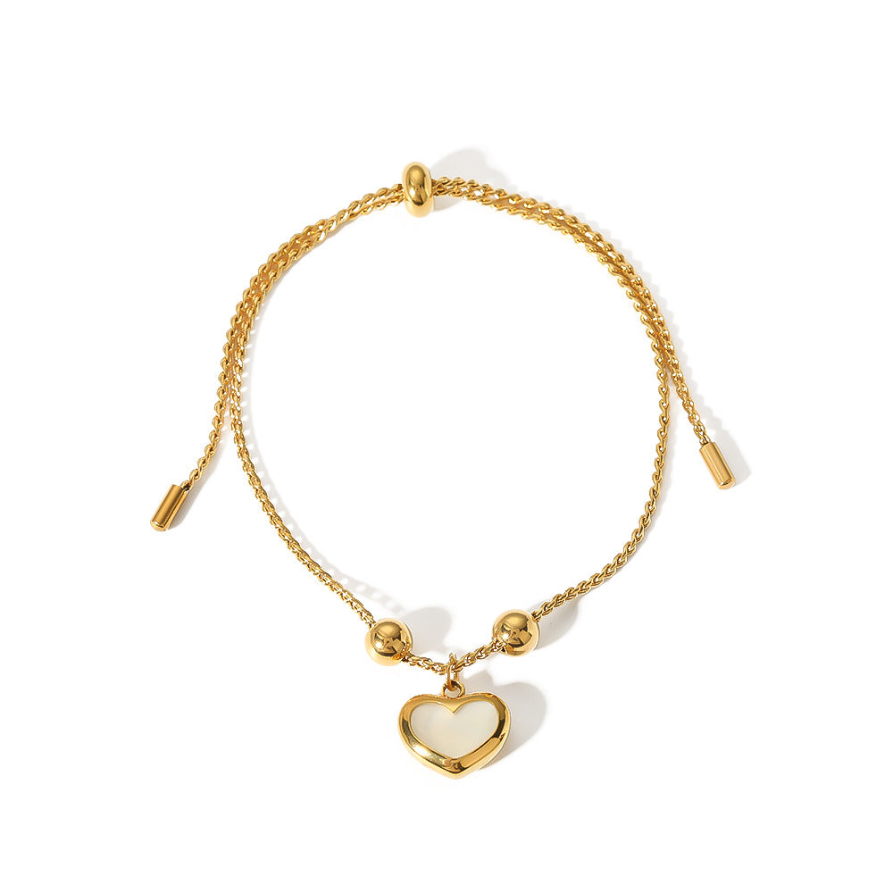 Bracciale regolabile minimalista retrò francese a forma di cuore con abalone bianco, dettagli geometrici e acciaio inossidabile placcato sottovuoto in oro 18 carati