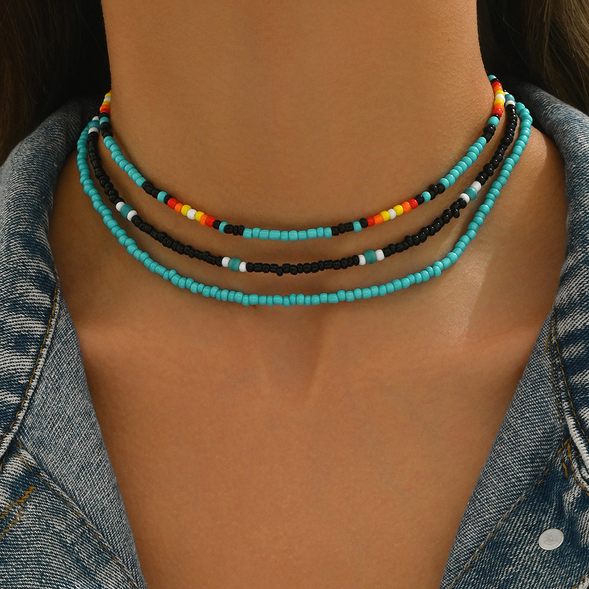 Collar largo de clavícula con múltiples capas geométricas para mujer, con cuentas de semillas coloridas tejidas a mano y diseño elíptico lineal