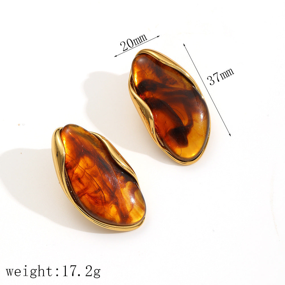 Conjunto de pulsera de resina de acero inoxidable y titanio de forma irregular y pendientes acrílicos de ámbar para mujer