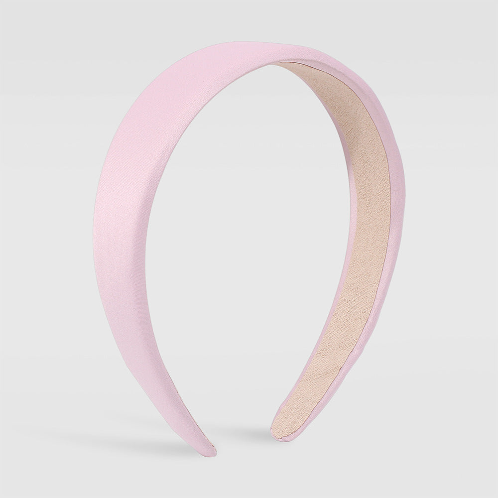 Diadema de tela en tonos pastel para mujer con diseño circular y acabado artesanal