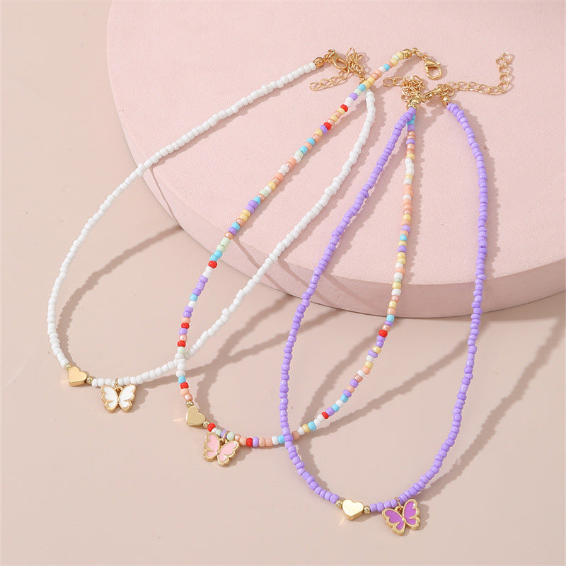 Collar artesanal bohemio con cuentas de cristal blancas en forma de corazón para niños