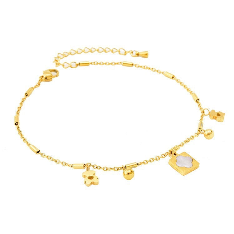 Bracciale Minimalista in Acciaio al Titanio a Forma di Orsetto con Accenti in Guscio Lucido e Lunghezza Regolabile