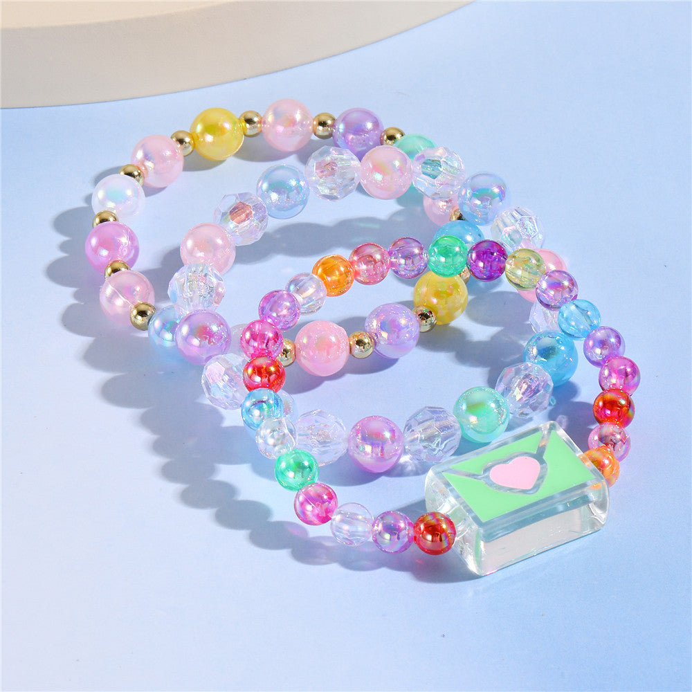 Juego de pulseras de resina con cuentas en forma de corazón estilo caricatura con dijes de cola de sirena y conchas marinas para niños