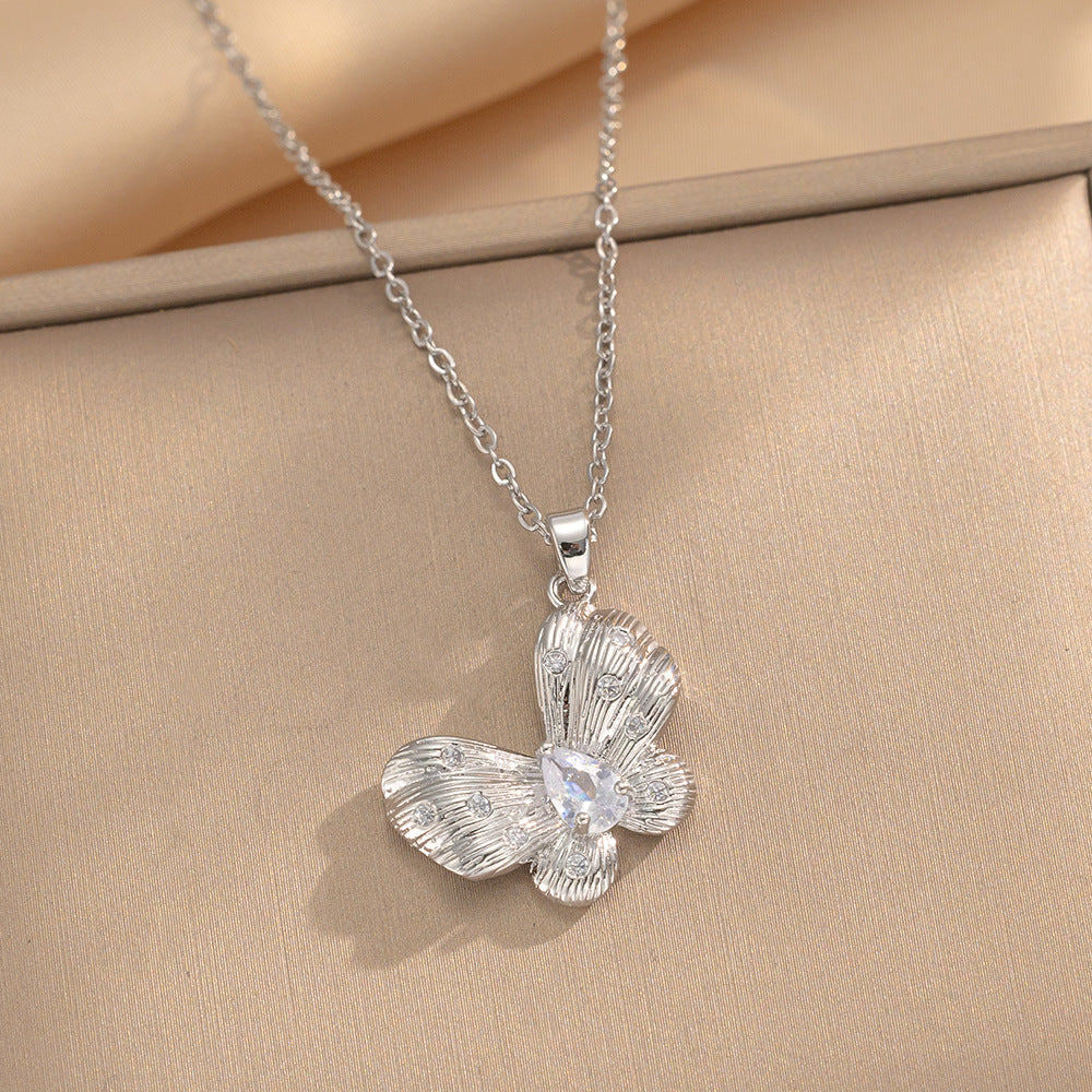 Minimalist Butterfly Pendant Necklace for Women in Brushed Titanium Steel with Rhinestone Inlay and Plated Finish