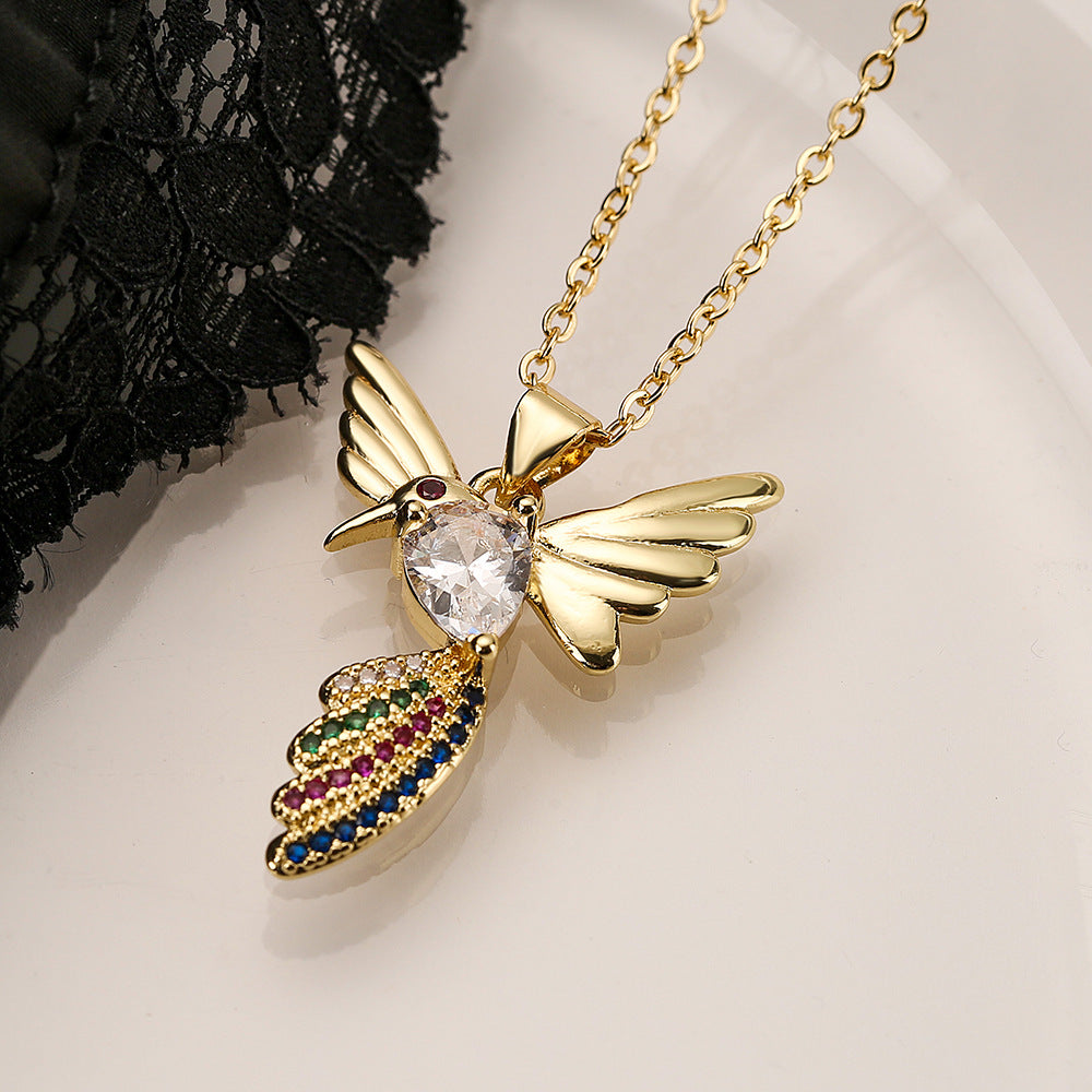 Collana con ciondolo a forma di uccello minimalista in rame placcato oro con zirconi per donna