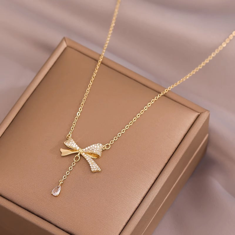 Minimalist Bow-Shaped Titanium Steel Pendant Necklace for Women with Plated Finish and Delicate Layered Look
