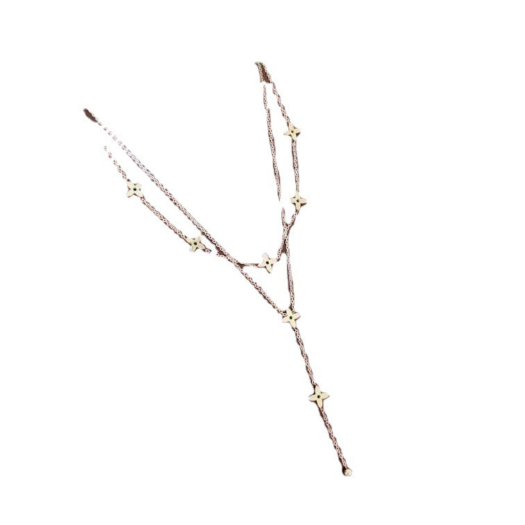 Collana da donna a doppio strato con ciondolo a L in acciaio al titanio placcato in stile cartone animato geometrico, con nappa e design a croce per clavicola