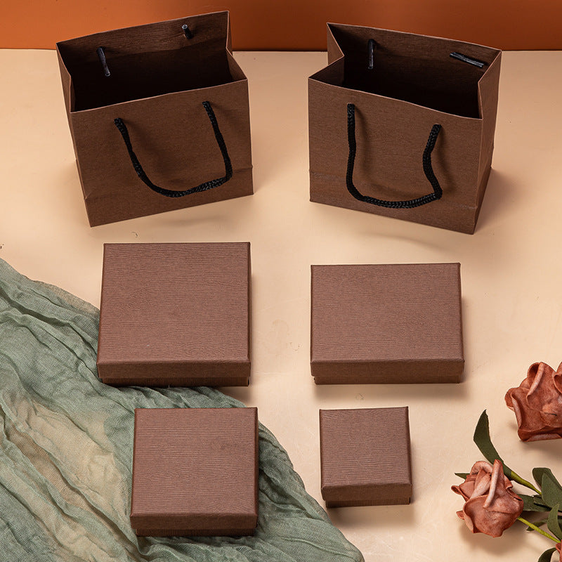 Caja de joyería de madera vintage con vetas para pendientes, collares, pulseras y anillos, con forro de terciopelo. Opciones en negro y marrón.