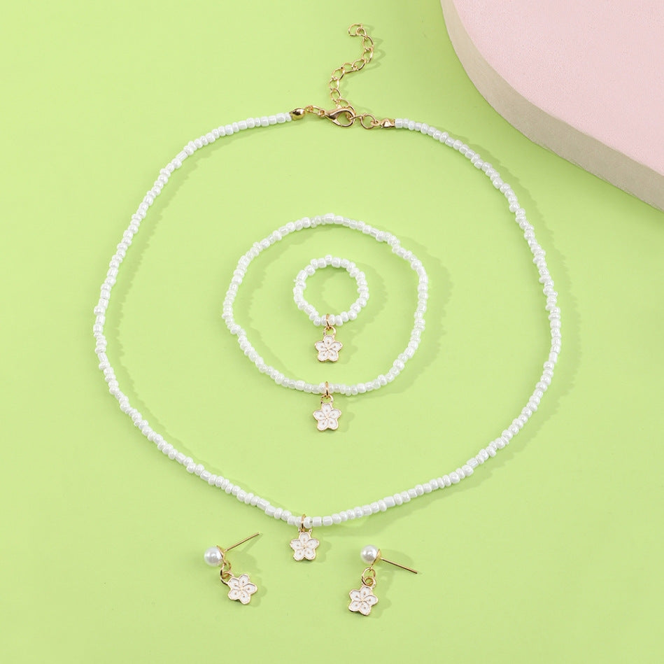 Set di collana con perline di vetro floreali minimaliste carine con bracciale anello e orecchini abbinati per bambini