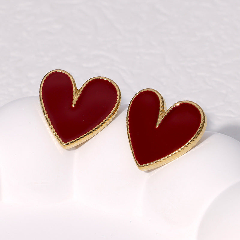 Orecchini a perno da donna in acciaio inossidabile a forma di cuore minimalista con finitura placcata