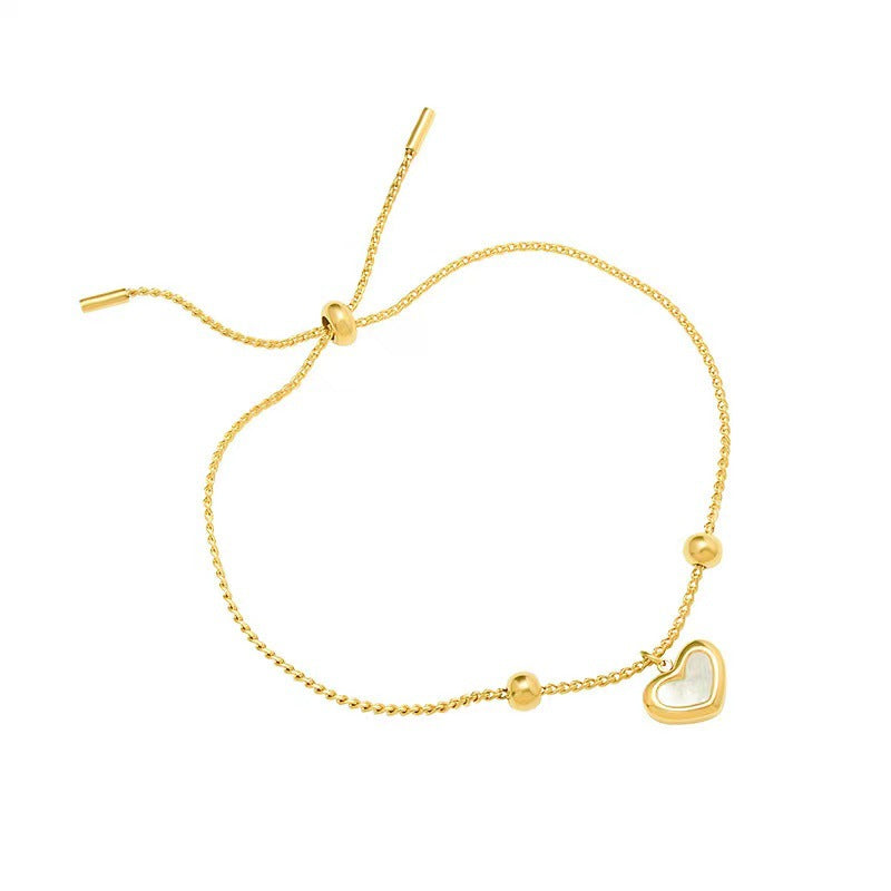 Bracciale Minimalista in Acciaio al Titanio a Forma di Cuore con Intarsio in Madreperla Bianca e Chiusura a Scorrimento da Donna