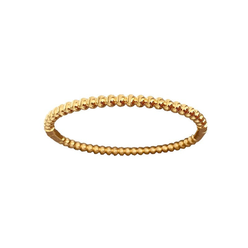 Bracciale minimalista da donna in acciaio al titanio color oro con perline rotonde lucide