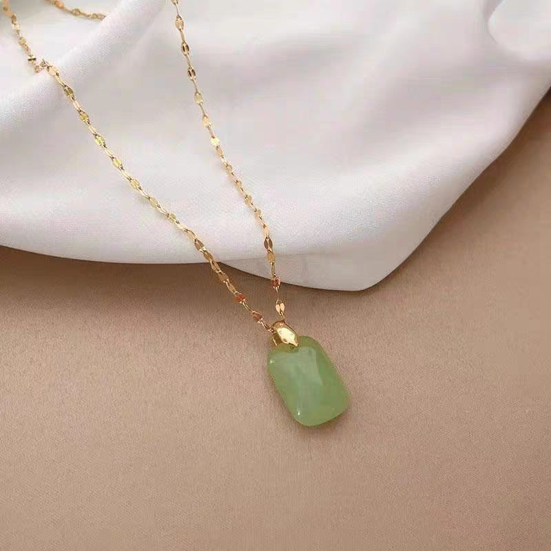 Collana da donna con ciondolo in acciaio al titanio dalla forma irregolare, design originale, con intarsio in lega di rame e finitura placcata