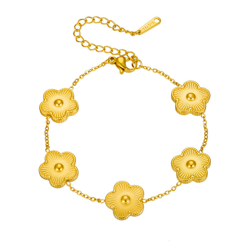 Bracciale da donna in acciaio al titanio placcato oro con motivo floreale alla moda