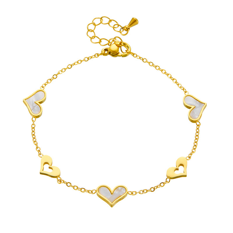 Pulsera de acero inoxidable bañada en oro con colgante de corazón hueco, estilo coreano minimalista, para mujer, para uso diario y como regalo de recuerdo de viaje