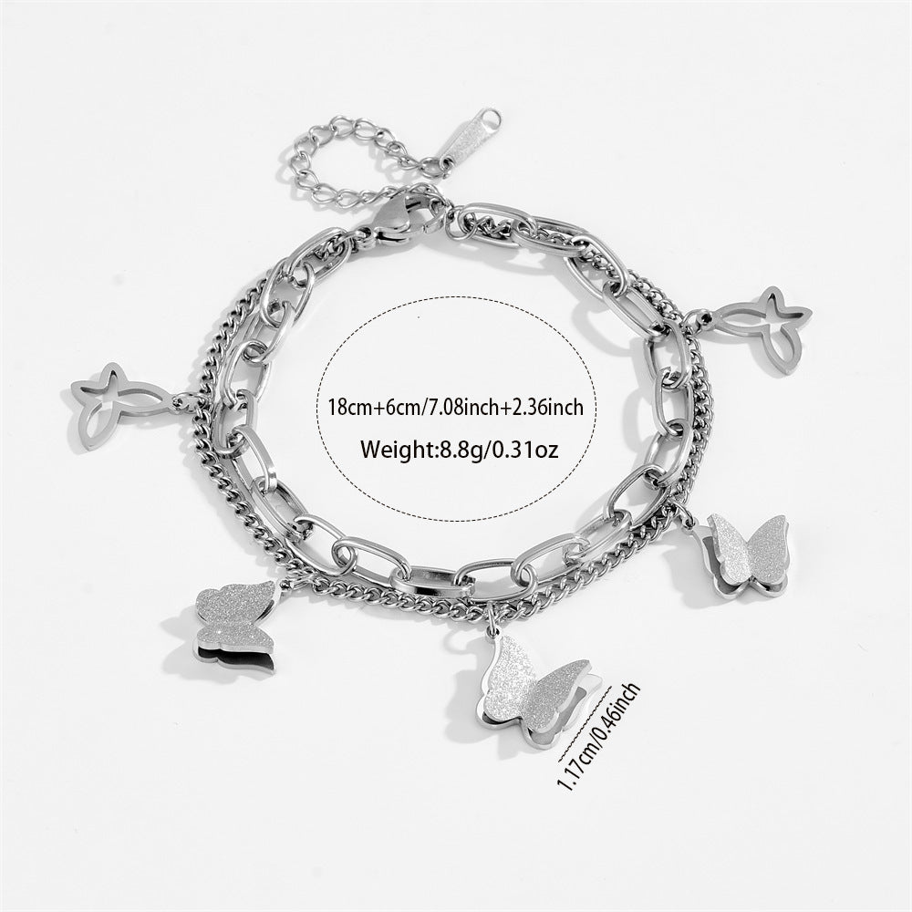 Bracciale a croce elegante a farfalla in acciaio inossidabile placcato oro con zirconi cubici da donna