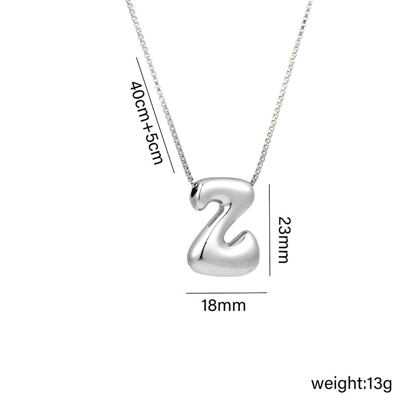 Collar con colgante de acero titanio con forma de letra minimalista y chapado en oro para mujer