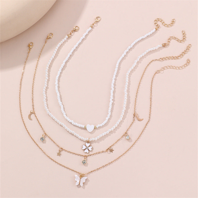 Bonito collar con dije de aleación esmaltado en forma de corazón para niños con cadena de eslabones torcidos