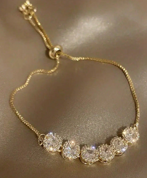 Bracciale da donna in lega di ottone placcato, con zirconi cubici micro-incastonati, rotondo, floreale e minimalista