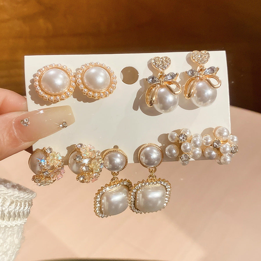 Juego de aretes de perlas con diseño de mariposa y flores para mujer con postes de acero, acabado esmaltado, moda minimalista para uso diario