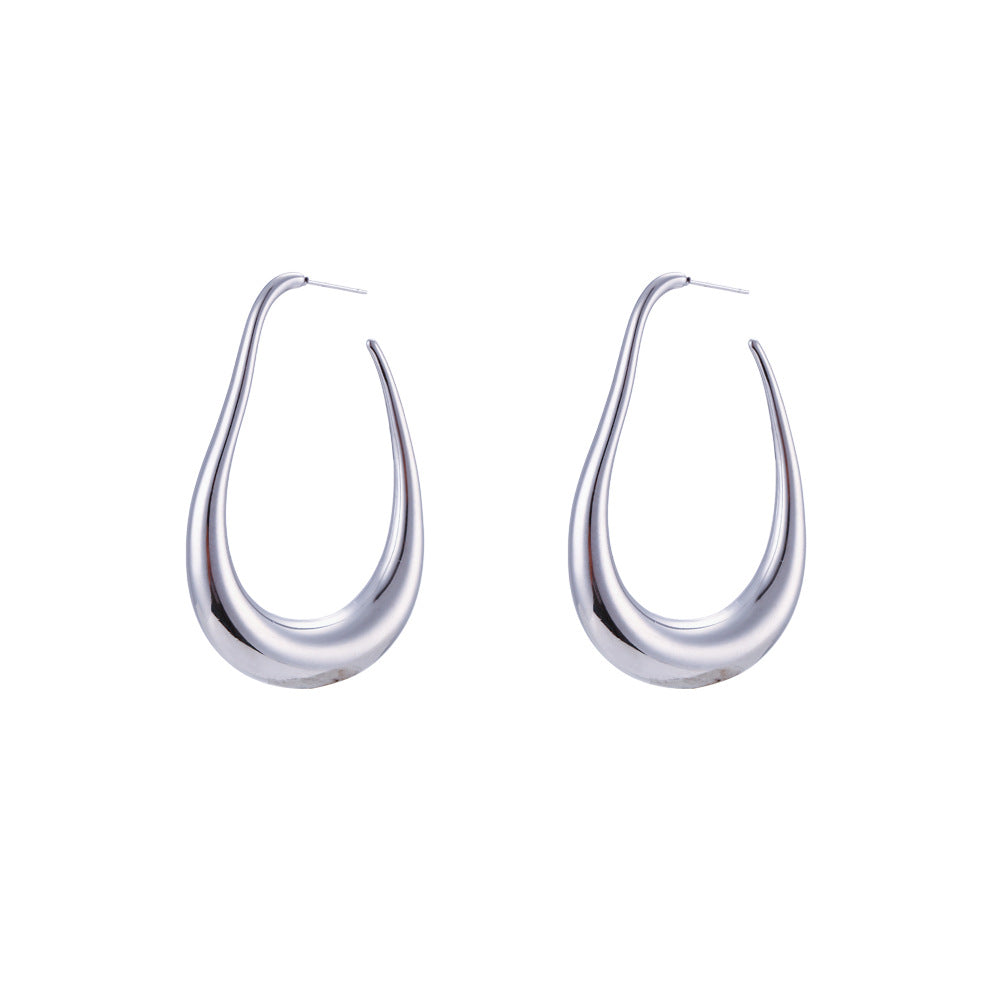 Pendientes de aro curvos huecos de acero inoxidable geométricos minimalistas chapados en oro de 18 quilates para mujer