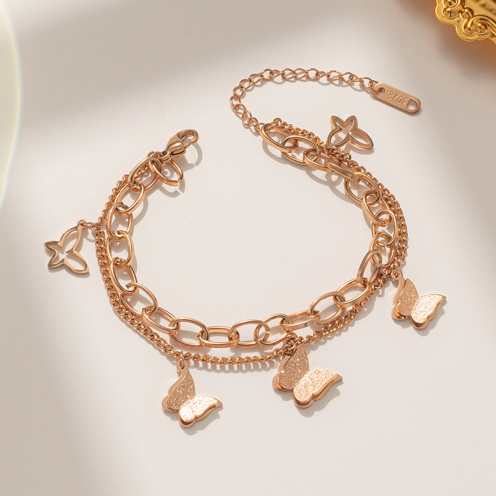 Bracciale a doppia farfalla in acciaio al titanio placcato oro rosa da donna con design geometrico e stile minimalista alla moda