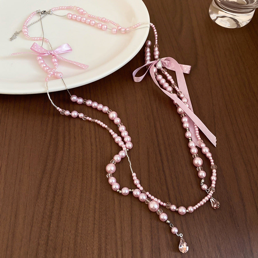 Elegante collar con colgante de lazo de diamantes de imitación de estilo francés con detalles de perlas de imitación, delicada cadena de suéter para mujer, uso diario minimalista y chic