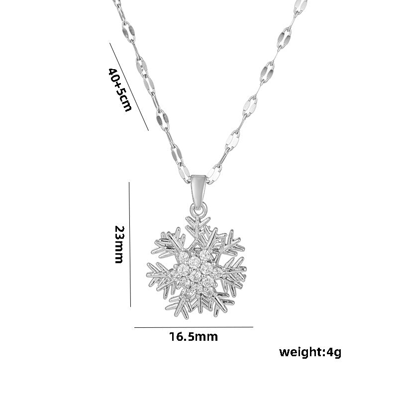 Collar con colgante giratorio de copo de nieve para mujer en acero de titanio con incrustaciones de diamantes de imitación en cadena ondulada