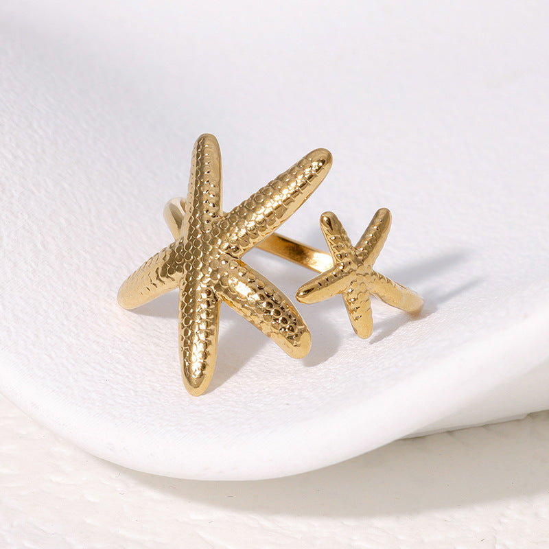 Elegante anello regolabile da donna in acciaio inossidabile a forma di stella marina con finitura placcata, gioiello da spiaggia ispirato all'oceano