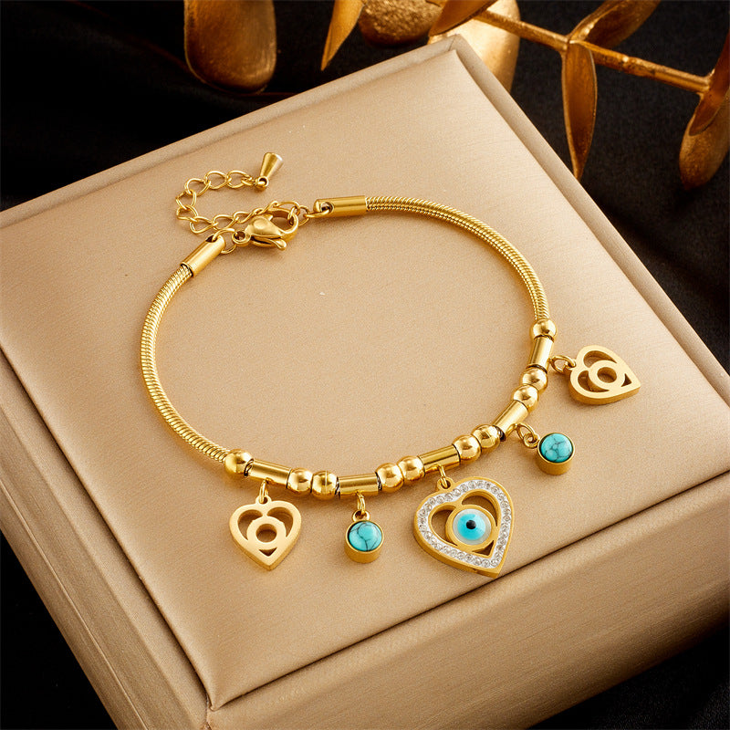 Fashionable Minimalist Heart-Shaped Rhinestone-Embellished Stainless Steel Bracelet with Multi-Layer Snake Chain and Butterfly Charm for Women