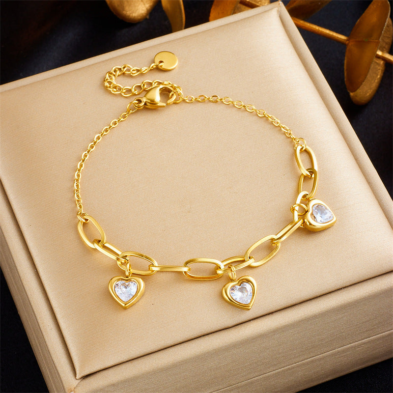 Bracciale a catena irregolare minimalista con ciondolo a cuore intarsiato di strass in acciaio inossidabile placcato oro da donna