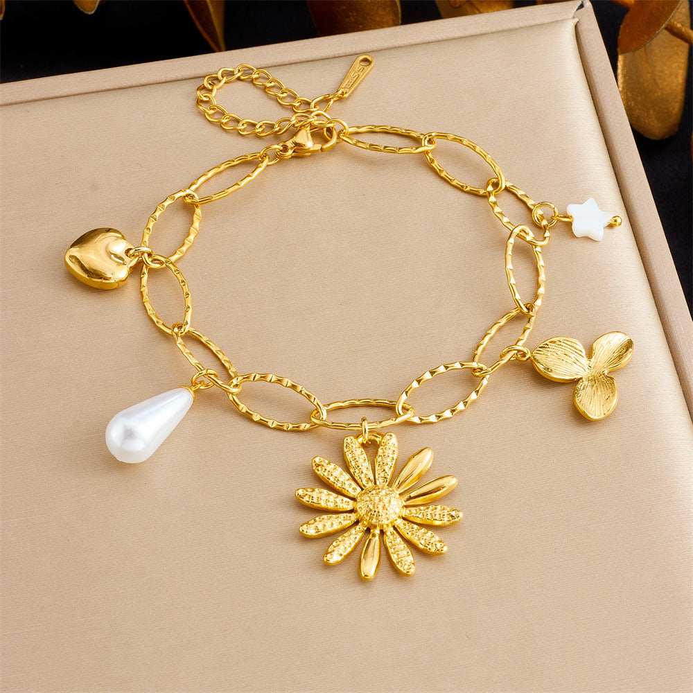 Bracciale con ciondolo floreale e a cuore in stile vintage in acciaio inossidabile con finitura placcata da donna