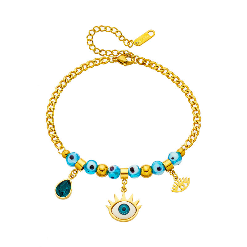 Bracciale alla moda con ciondolo a goccia asimmetrico a forma di occhio blu con perline in acciaio al titanio placcato per donne e uomini