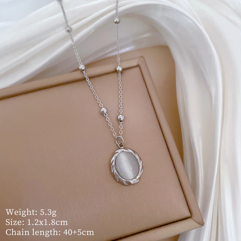 Collana girocollo da donna con ciondolo in pietra occhio di gatto girevole in acciaio inossidabile placcato oro dal design geometrico minimalista